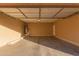 Spacious garage with open floor plan and overhead door at 41705 N Globe Ct, Phoenix, AZ 85086