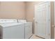 Convenient laundry room with washer, dryer, and storage at 41705 N Globe Ct, Phoenix, AZ 85086