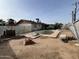 Backyard with pool, chain link fence, and various debris at 4402 W Verde Ln, Phoenix, AZ 85031