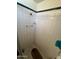 Small shower stall with white tile and a shower head at 4402 W Verde Ln, Phoenix, AZ 85031