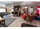 Combined living and dining area with a fireplace and large windows at 4402 W Verde Ln, Phoenix, AZ 85031