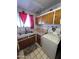 Galley style kitchen with wood cabinets and a double sink at 4402 W Verde Ln, Phoenix, AZ 85031