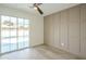 Bright bedroom with wood-look floors, pool view, and modern wall accents at 4910 W Townley Ave # 4910, Glendale, AZ 85302