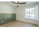 Light and airy bedroom featuring wood-look floors and a pool view at 4910 W Townley Ave # 4910, Glendale, AZ 85302