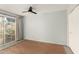 Bright bedroom with wood floors and sliding door access to a patio at 5005 S Mill Ave, Tempe, AZ 85282