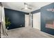 Bedroom with gray carpet, double closets, and ceiling fan at 5005 S Mill Ave, Tempe, AZ 85282