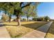 Community with a grassy area and mature trees at 5005 S Mill Ave, Tempe, AZ 85282