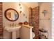 Bathroom with exposed brick and updated vanity at 5113 W Arrowhead Lakes Dr, Glendale, AZ 85308