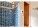 Shower with blue tile and glass enclosure at 5113 W Arrowhead Lakes Dr, Glendale, AZ 85308