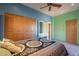 Bright bedroom with double doors and carpet flooring at 5113 W Arrowhead Lakes Dr, Glendale, AZ 85308