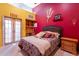 Bedroom with double doors and ASU themed decor at 5113 W Arrowhead Lakes Dr, Glendale, AZ 85308