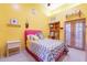 Bright bedroom with double doors leading to backyard at 5113 W Arrowhead Lakes Dr, Glendale, AZ 85308