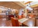 Large dining area with a wooden table and seating for multiple guests at 5113 W Arrowhead Lakes Dr, Glendale, AZ 85308