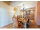 Elegant dining room featuring a large table and chandelier at 5113 W Arrowhead Lakes Dr, Glendale, AZ 85308