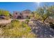 Spanish style home with landscaping and mountain views at 5113 W Arrowhead Lakes Dr, Glendale, AZ 85308