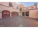 Spanish style home with double door entry and attached two-car garage at 5113 W Arrowhead Lakes Dr, Glendale, AZ 85308