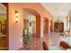 Bright hallway with terracotta tile floors and arched doorways at 5113 W Arrowhead Lakes Dr, Glendale, AZ 85308