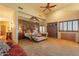 Spacious main bedroom with brick feature wall and plush carpet at 5113 W Arrowhead Lakes Dr, Glendale, AZ 85308