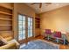 Home office with built-in shelves and balcony access at 5113 W Arrowhead Lakes Dr, Glendale, AZ 85308