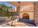 Charming outdoor fireplace with tiled accents and built-in seating area at 5113 W Arrowhead Lakes Dr, Glendale, AZ 85308