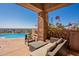 Covered patio with wicker furniture and a stunning view at 5113 W Arrowhead Lakes Dr, Glendale, AZ 85308