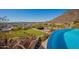 Infinity pool with a scenic view of the city and mountains at 5113 W Arrowhead Lakes Dr, Glendale, AZ 85308