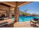 Inviting pool area with brick accents, comfortable seating, and stunning mountain views at 5113 W Arrowhead Lakes Dr, Glendale, AZ 85308