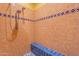 Spacious shower with tiled walls and built-in seat at 5113 W Arrowhead Lakes Dr, Glendale, AZ 85308