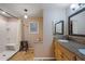 Modern bathroom with double vanity, granite countertops, and shower/tub combo at 5402 E Mckellips Rd # 276, Mesa, AZ 85215