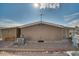 Rear view of the house showing a patio and AC unit at 5402 E Mckellips Rd # 276, Mesa, AZ 85215