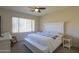 Bright bedroom with a king-size bed, plenty of closet space and a ceiling fan at 5845 N Turquoise Ln, Eloy, AZ 85131