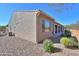 Tan stucco house with a covered patio and nicely landscaped yard at 5845 N Turquoise Ln, Eloy, AZ 85131