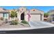 Single-story home with two-car garage and landscaped front yard at 5845 N Turquoise Ln, Eloy, AZ 85131