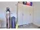 Garage with storage cabinets and water softener system at 5845 N Turquoise Ln, Eloy, AZ 85131