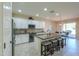 Spacious kitchen with island, granite counters, and white cabinets at 5845 N Turquoise Ln, Eloy, AZ 85131