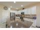 Modern kitchen with stainless steel appliances and breakfast bar at 5845 N Turquoise Ln, Eloy, AZ 85131