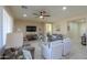 Relaxing living room featuring neutral tones, comfortable sofas and a large TV at 5845 N Turquoise Ln, Eloy, AZ 85131