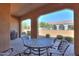 Covered patio with table and chairs, great for outdoor dining at 5845 N Turquoise Ln, Eloy, AZ 85131