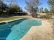 Refreshing blue pool surrounded by trees and grass at 6124 N 130Th Ave, Litchfield Park, AZ 85340