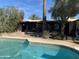 Relaxing pool area with patio and view of home at 6124 N 130Th Ave, Litchfield Park, AZ 85340