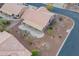 An aerial view showcasing a house with a carport and desert landscaping at 6403 S Fairway Dr, Gold Canyon, AZ 85118