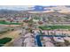 Aerial view of homes and a golf course with mountains in the background at 6403 S Fairway Dr, Gold Canyon, AZ 85118