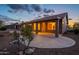 Home with covered patio, desert landscaping, and exterior lighting at 6403 S Fairway Dr, Gold Canyon, AZ 85118