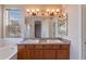 Double vanity bathroom with large mirror and updated lighting at 6403 S Fairway Dr, Gold Canyon, AZ 85118