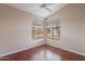 Bedroom with wood flooring and large corner windows at 6403 S Fairway Dr, Gold Canyon, AZ 85118