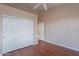 Bedroom with double door closet and wood flooring at 6403 S Fairway Dr, Gold Canyon, AZ 85118