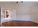 Bedroom featuring wood flooring and access to another room at 6403 S Fairway Dr, Gold Canyon, AZ 85118