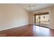 Bedroom with hardwood floors and sliding door to patio at 6403 S Fairway Dr, Gold Canyon, AZ 85118