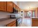 Kitchen with stainless steel appliances and wood cabinetry at 6403 S Fairway Dr, Gold Canyon, AZ 85118