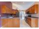 Kitchen with wood cabinets, granite countertops, and stainless steel appliances at 6403 S Fairway Dr, Gold Canyon, AZ 85118